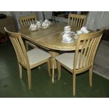 An extending dining table and four chairs