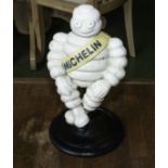 Michelin man sitting and one other
