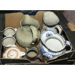 A box containing four pottery jugs and other pottery