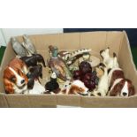 A box containing pottery birds and animals