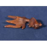 Hardwood netsuke of a goldfish