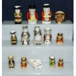 A collection of miniature character jugs