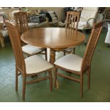 A kitchen table and four dining chairs