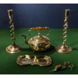 A pair of barley twist candle sticks, a kettle, candle snuffer and tray