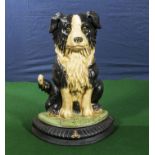 A cast sheepdog doorstop