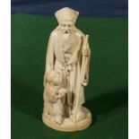 A Chinese ivory figure man with staff and boy holding a turtle (18cm tall)