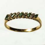 A 9ct gold baguette cut emerald and diamond ring, size U