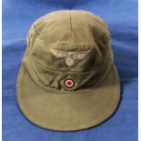 A German Tropical Troups M43 cap, red liner and air vents. Makers mark, size and 1941 stamped