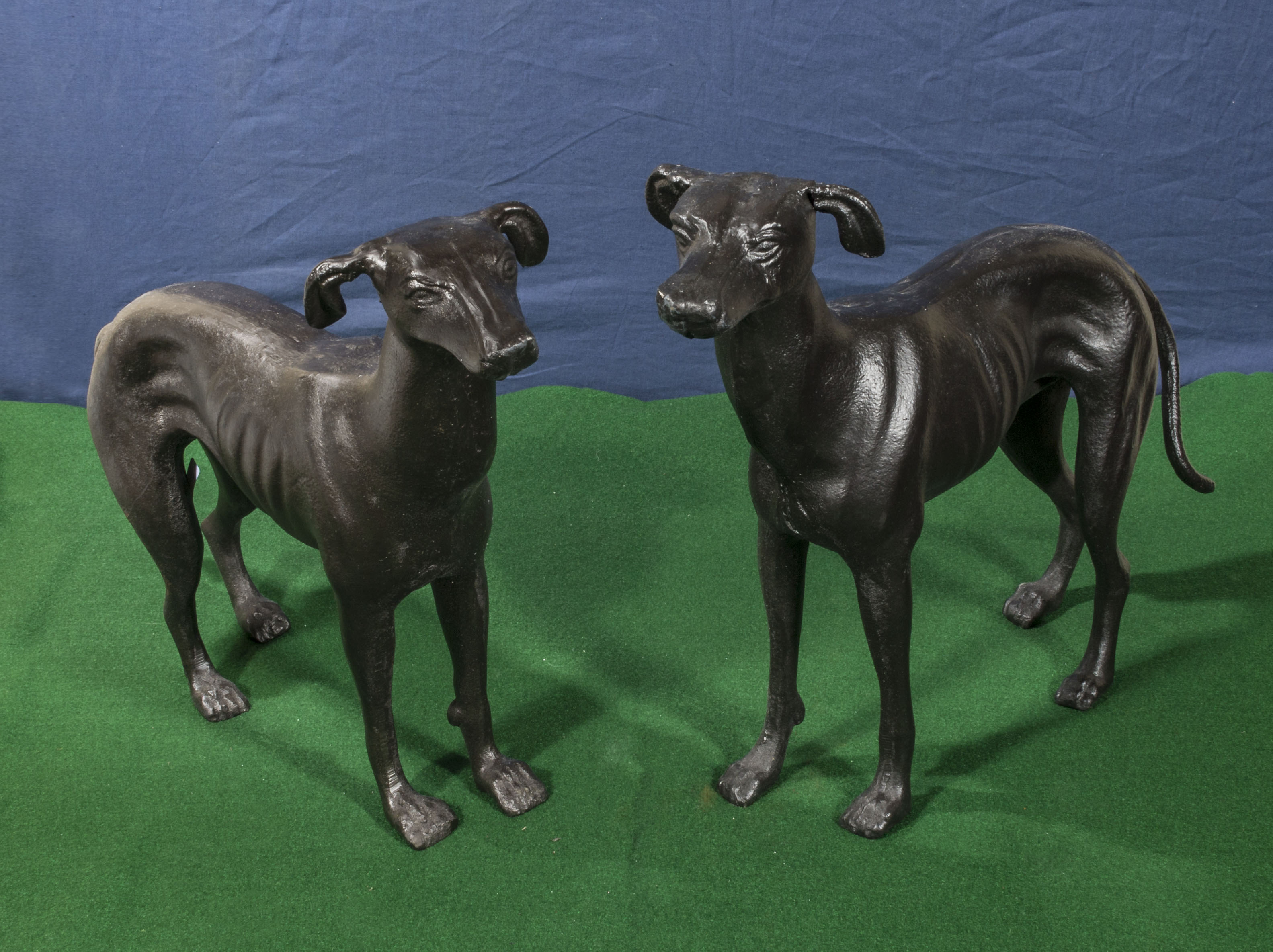 A pair of cast greyhound figures