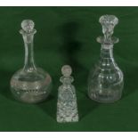 Two glass decanters and a perfume bottle