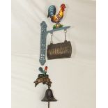 Large and small cast cockerel welcome signs