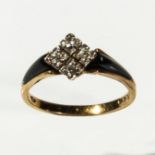 An 18ct gold four diamond and black enamel ring, size M