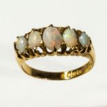 An 18ct gold five stone opal ring, size P