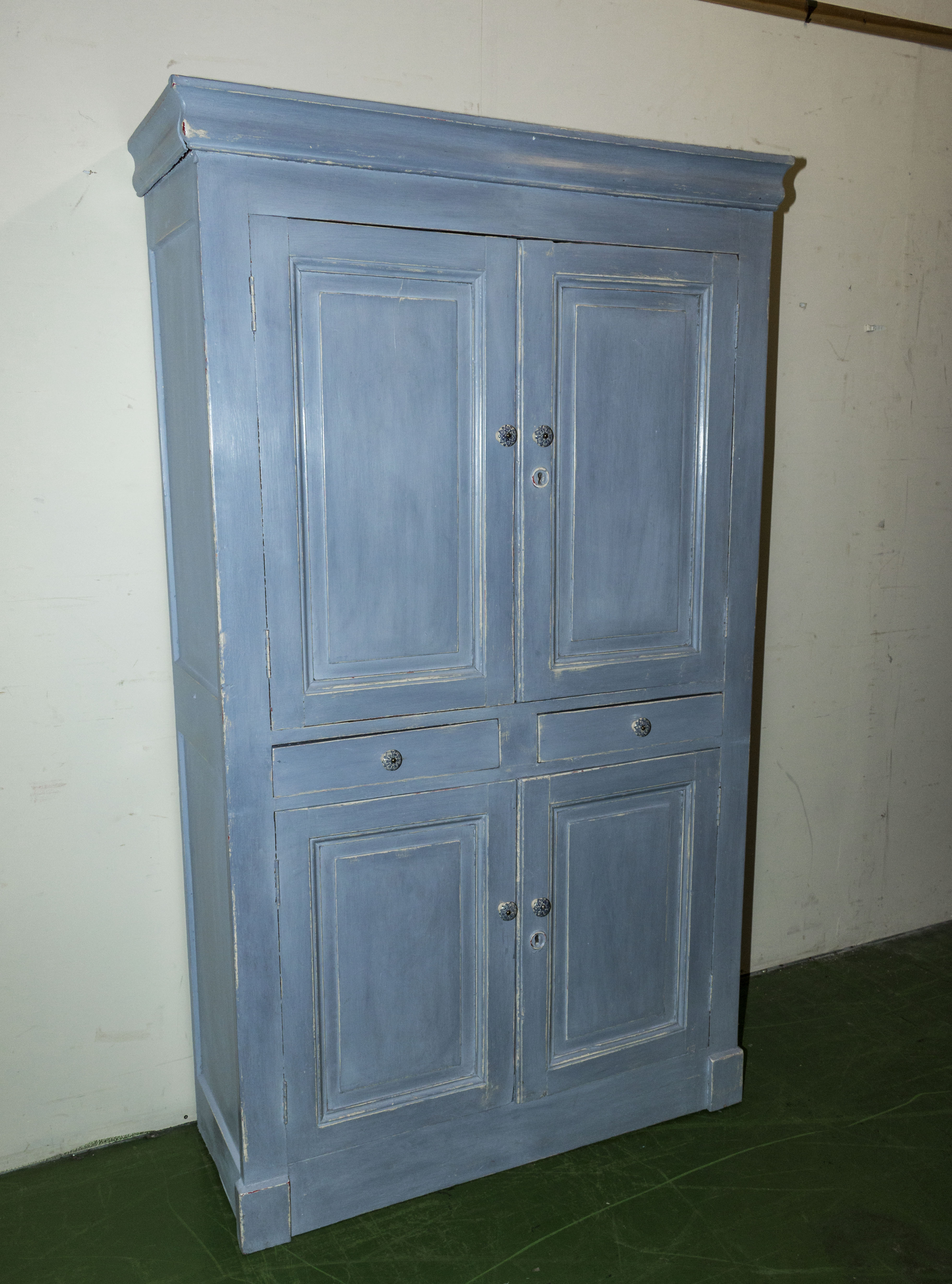 A Victorian painted four door kitchen cupboard
