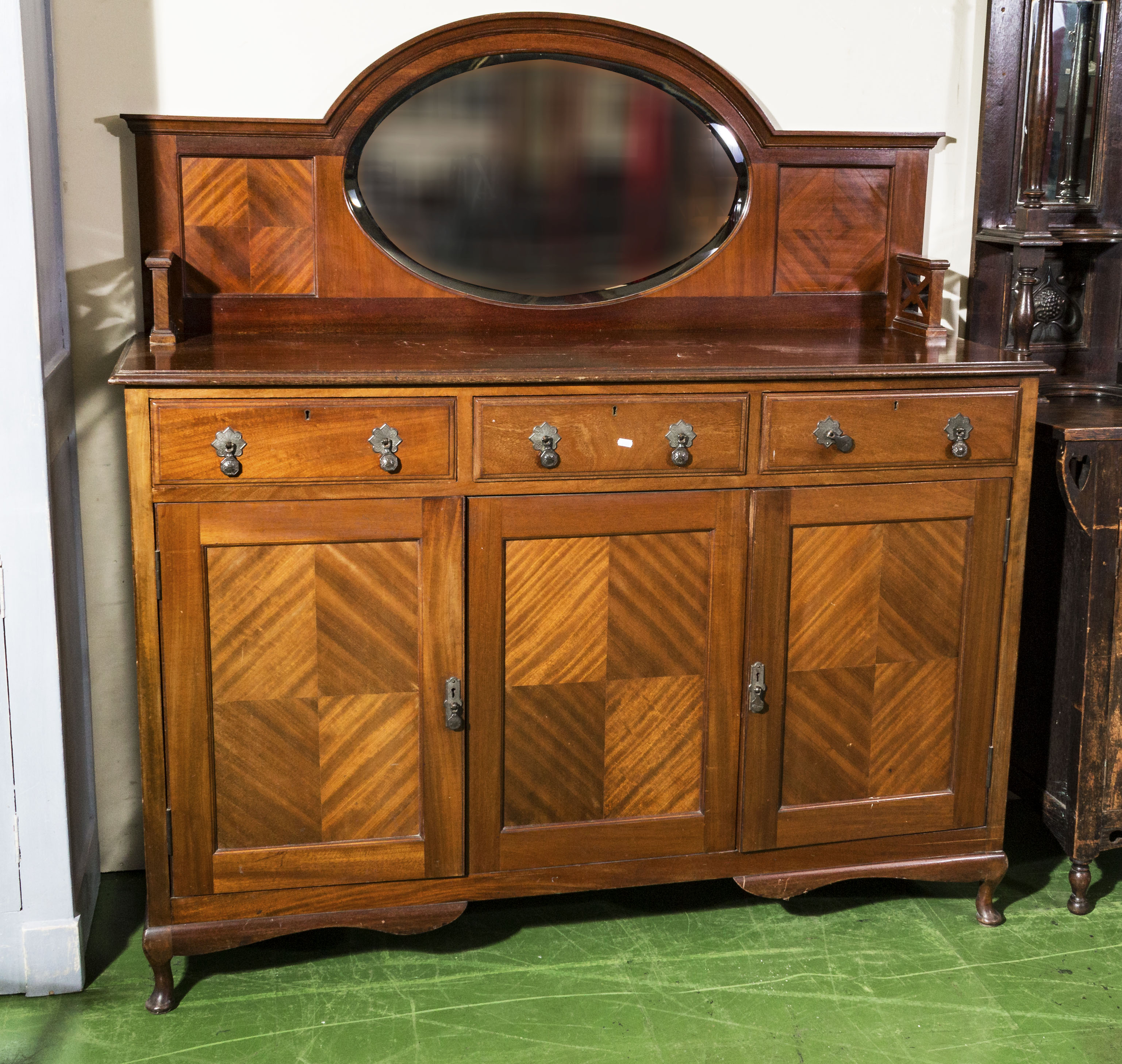 A 1930s mahogany sideboard with mirror back