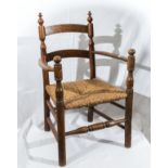 A small rush seated oak chair.