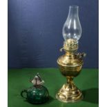 A brass oil lamp and a glass oil lamp