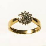 A 9ct gold diamond cluster ring. size K