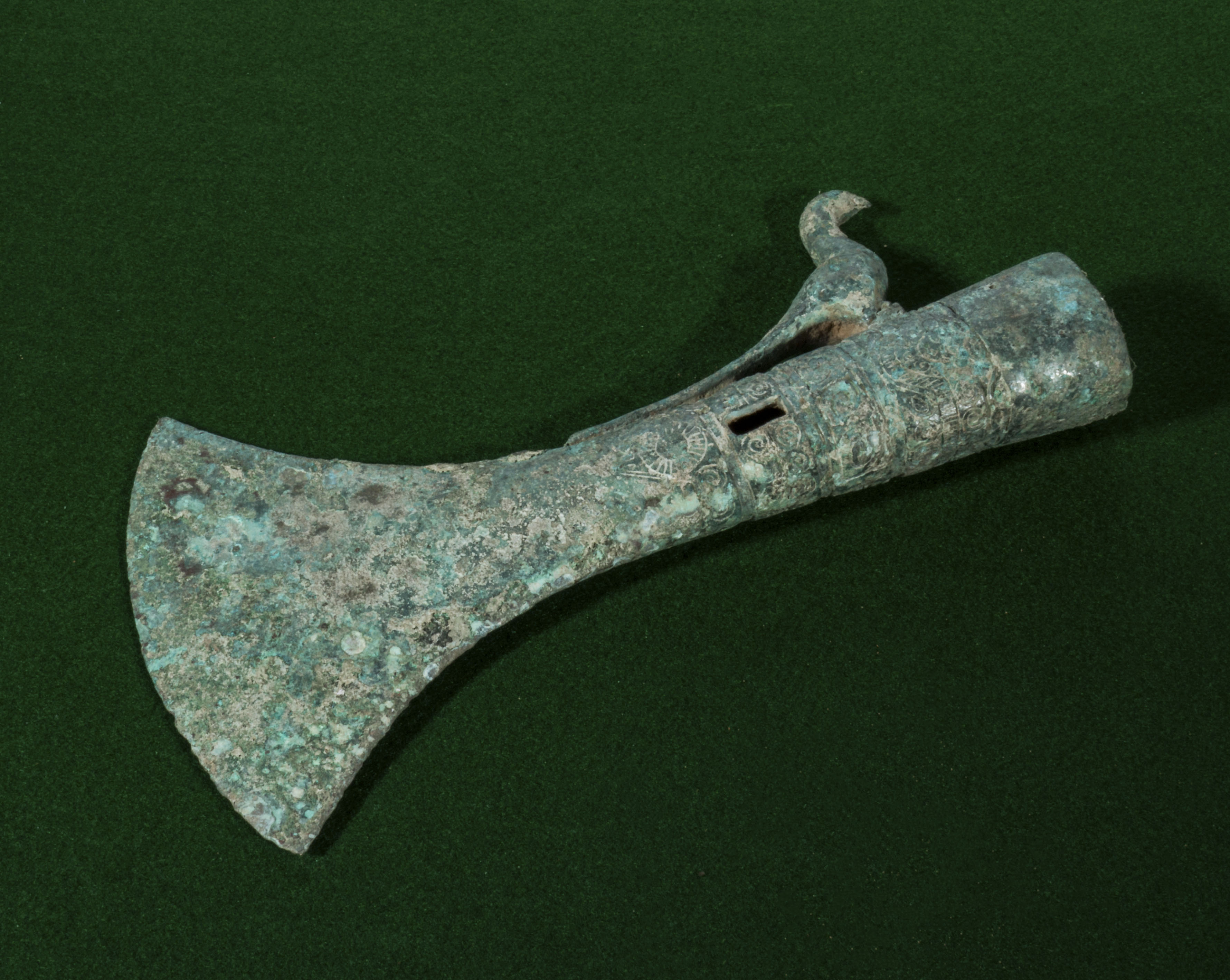 A Chinese Warring States dynasty style bronze pole axe with bird decoration