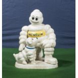 Cast Michelin figure with a dog