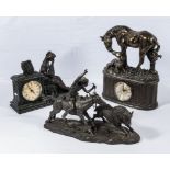 Two decorative 20th century clocks and a spelter figure group