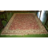 A large red ground wool rug