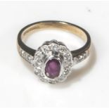 A 9ct gold ruby and diamond cluster ring, size L