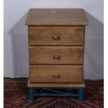 A small pine chest of three drawers