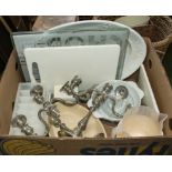 A box containing assorted kitchen ware and two candlesticks