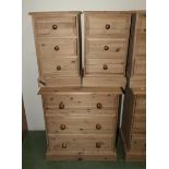 A pine chest of three drawers together with two bedside drawers