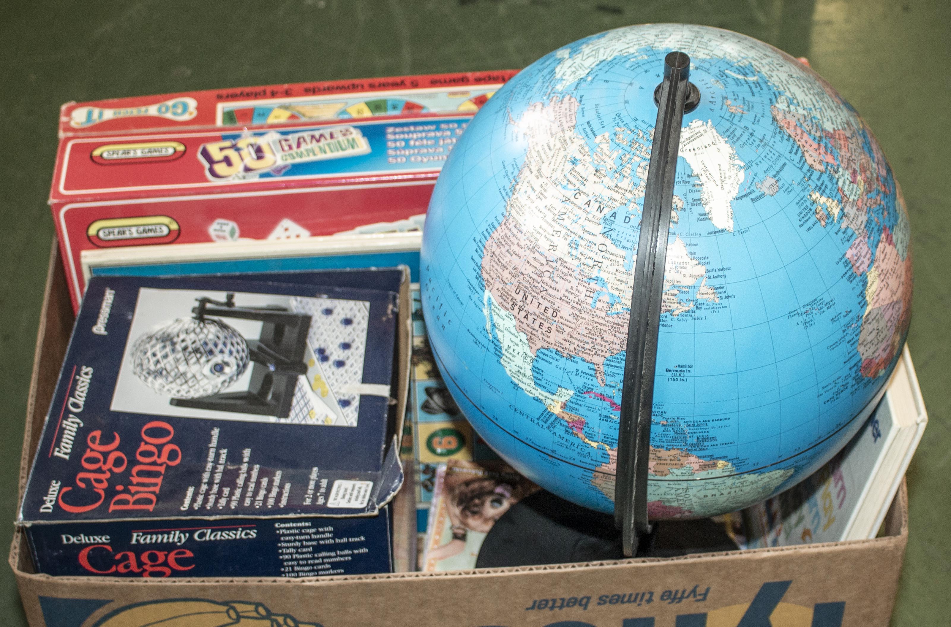 A box of games and a globe