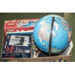 A box of games and a globe