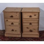 A pair of pine bedside drawers