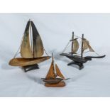 Two small horn ships and a wooden one