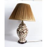 A Chinese style porcelain table lamp with shade decorated with a leaf design, base 40cm tall