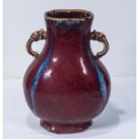 A 20th century Chinese oxblood two handled vase