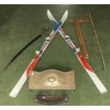 A pair of vintage skis, sword, T square, cue rest and two fire fronts