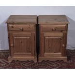 A pair of pine bedside cupboards