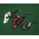 A Swiss made Meerschaum style pipe and two others