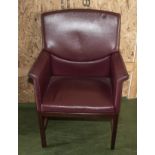 A leather upholstered armchair