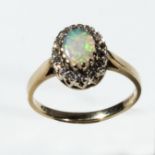 A 9ct gold opal and diamond cluster ring, size N