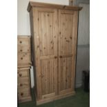 Two pine single wardrobes