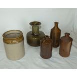 Five stoneware bottles and a jar