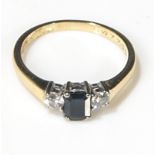 An 18ct blue/black sapphire and diamond ring, size R