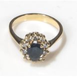 An 18ct yellow gold sapphire and diamond cluster, size O