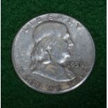 A 1958 silver Franklin half dollar
