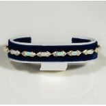 A 9ct yellow gold opal and diamond bracelet