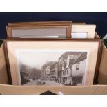 A box containing framed prints