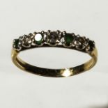 A 9ct gold seven stone emerald and diamond ring, size N