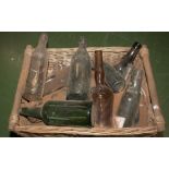 A box containing vintage bottles